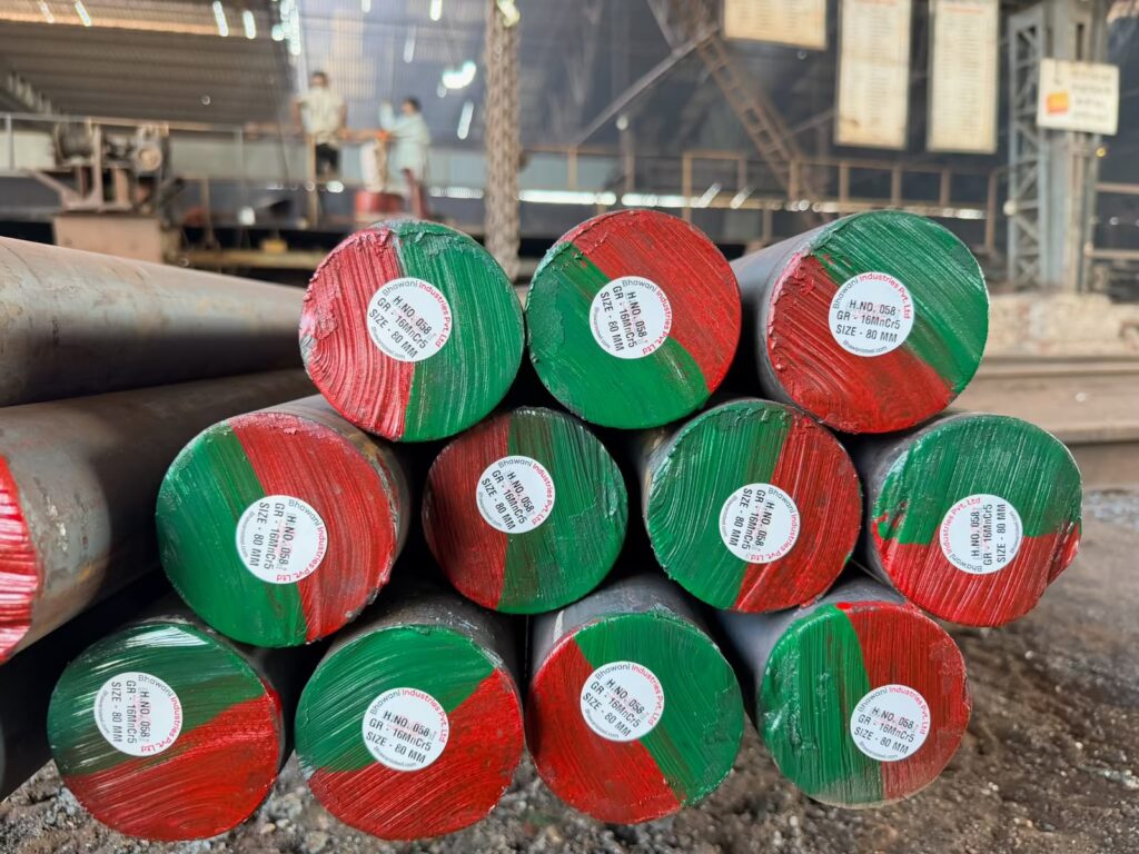 Red-and-green colour-coded round bars stacked for dispatch