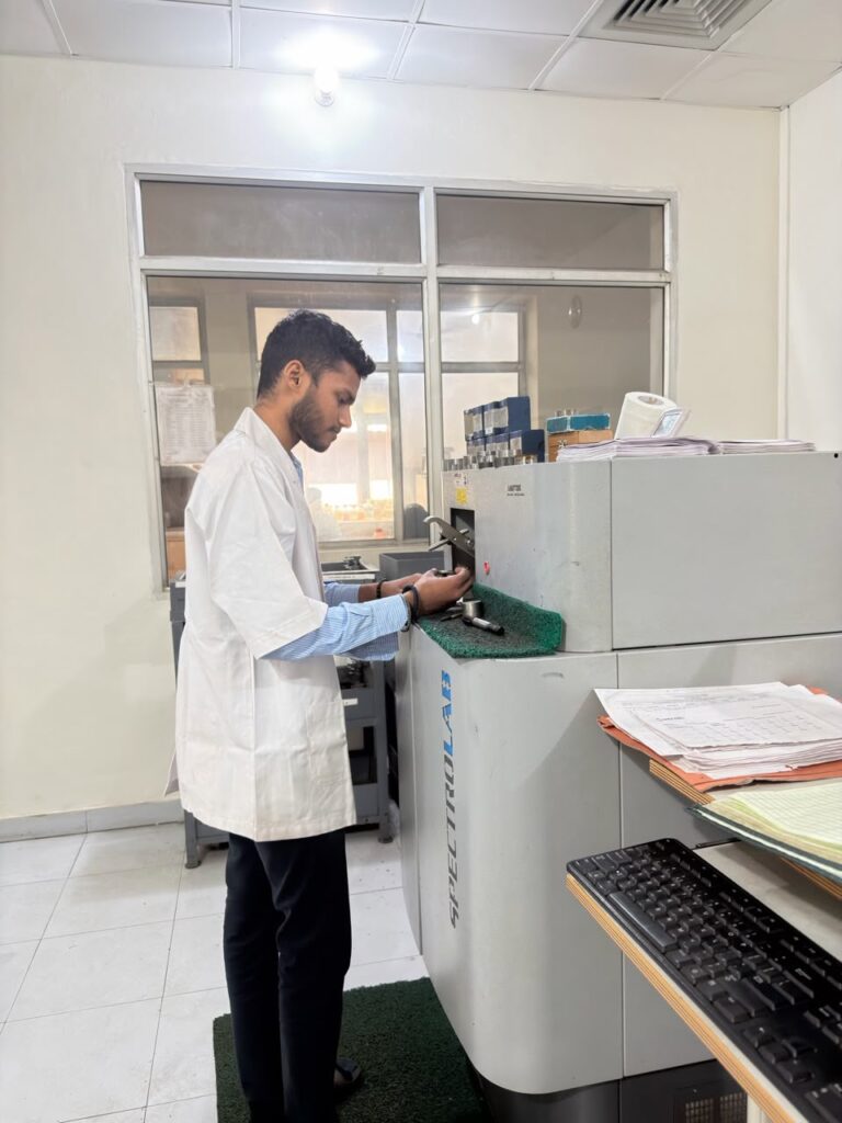 Technician running a spectrometer analysis