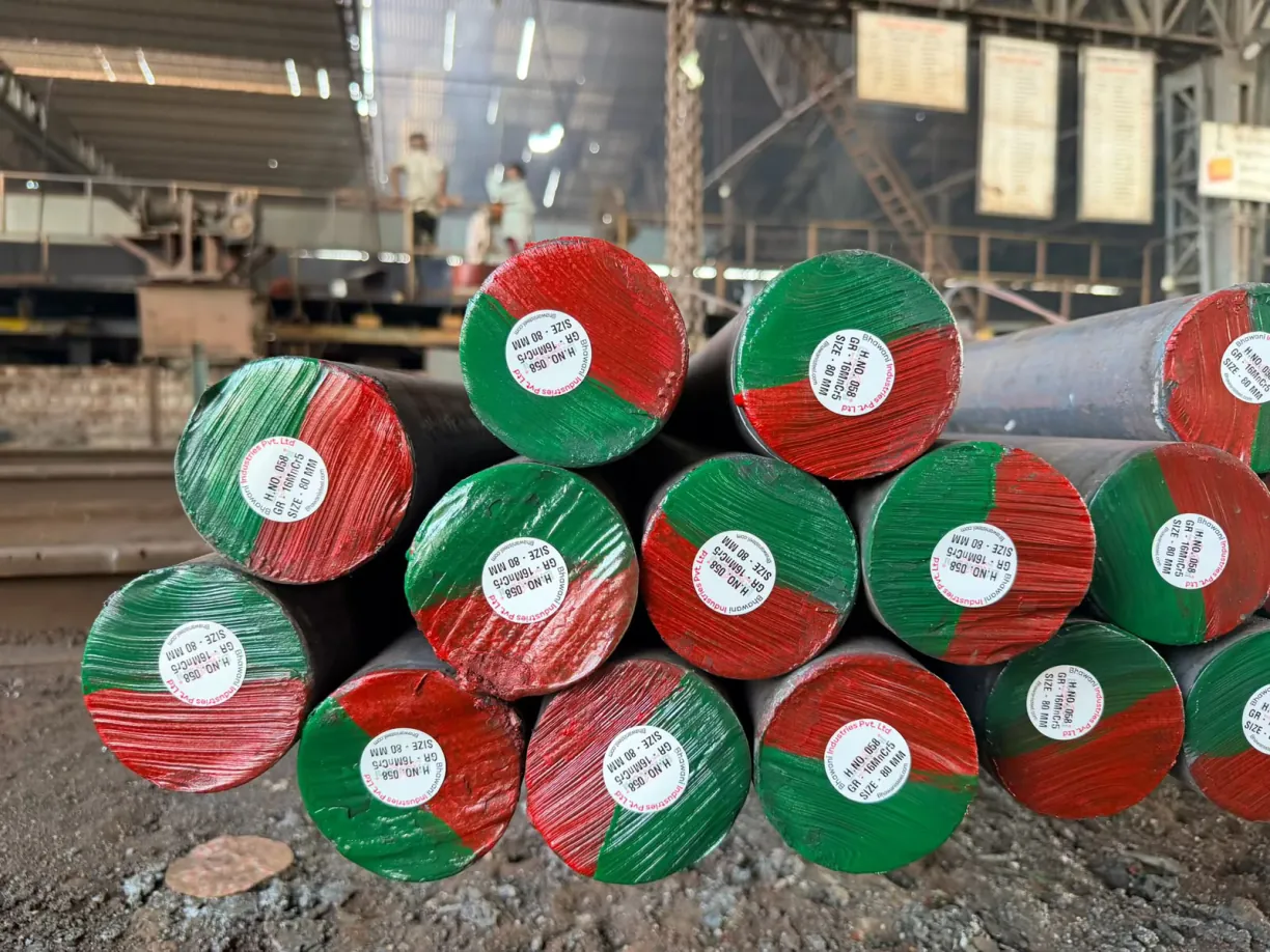 Hot rolled steel rounds stacked in the yard with colour-coded ends